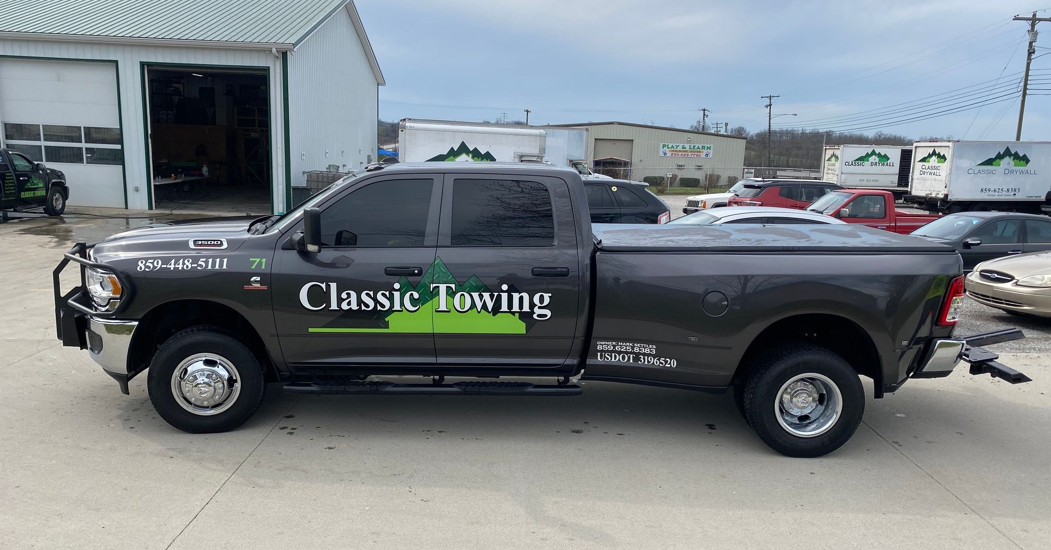 Classic Drywall fleet — branded box trucks and Ram 3500